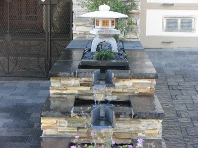 Small front yard waterfall with Japanese accent