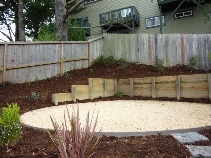 Circular permeable patio using light tan colored decomposed granite.  