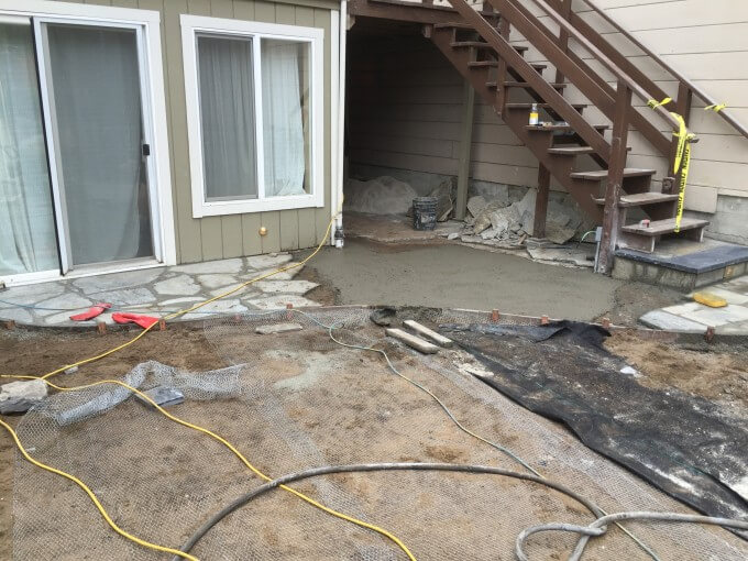 Setting flagstones for an entrance into the home.