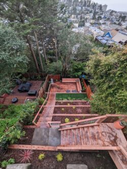 Ashbury Heights completed project aerial view with retaining walls, stairs, and deck.