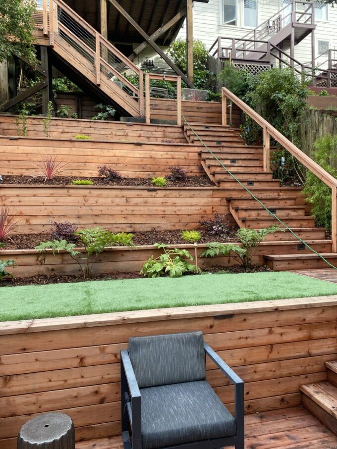 Five tiered retaining walls at Ashbury Heights project with artificial turf on bottom.