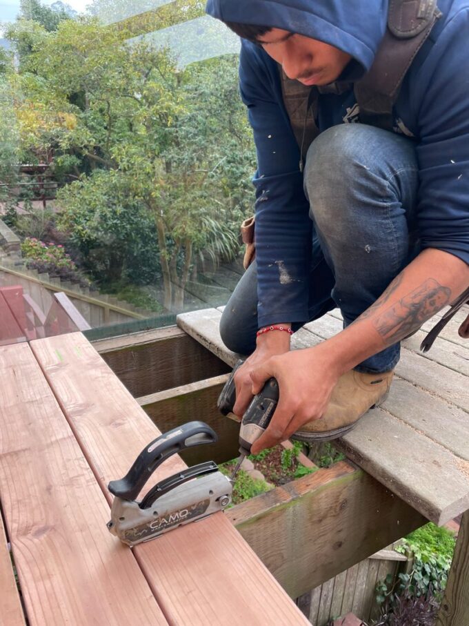 Camo tool used to fasten redwood planks to fabricate "nail-less" deck.