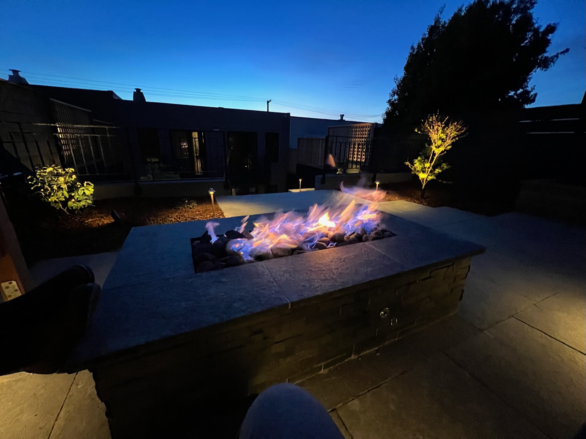 Beautiful warm glow of the fire pit at night at Outer Sunset, San Francisco project.