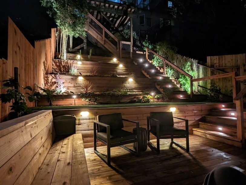 Ashbury Heights backyard at night from bottom deck.