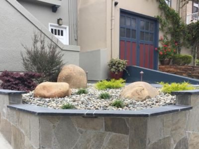 Rock wall and garden with plants for an Asian-style landscape, by Tamate Landscaping